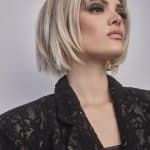 Short blonde bob wig with layered style and side-swept bangs.